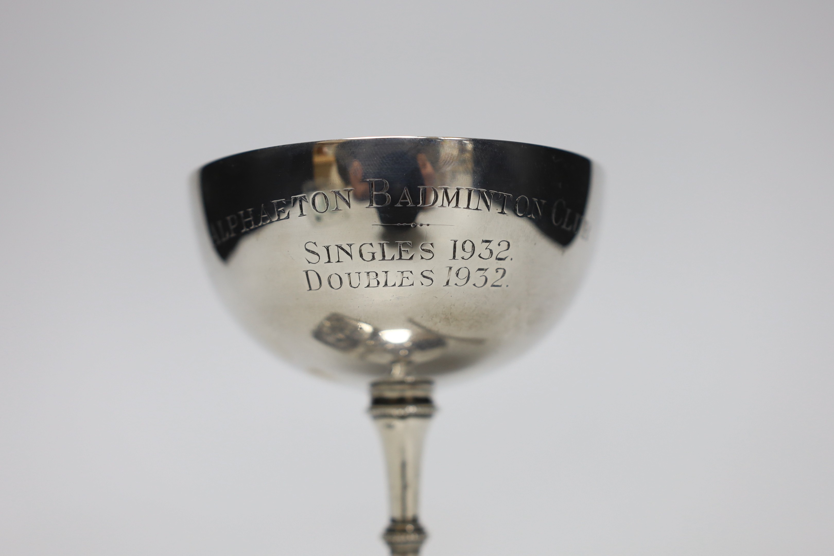 A George V silver Champagne coupe, Birmingham, 1923, 11.4cm with engraved inscription, a silver vesta case and a boxed swizzle stick.